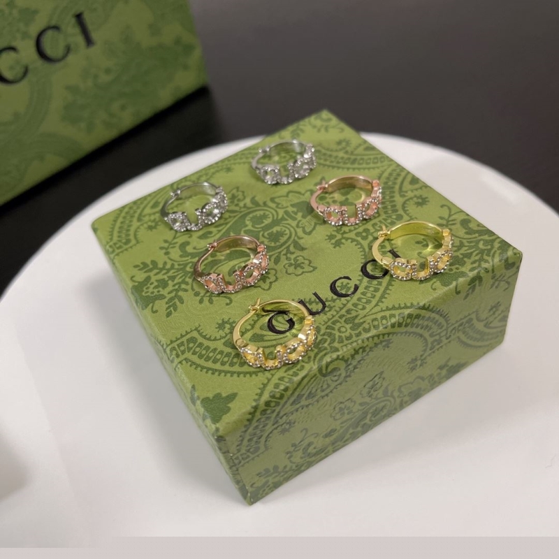G*u*i earrings